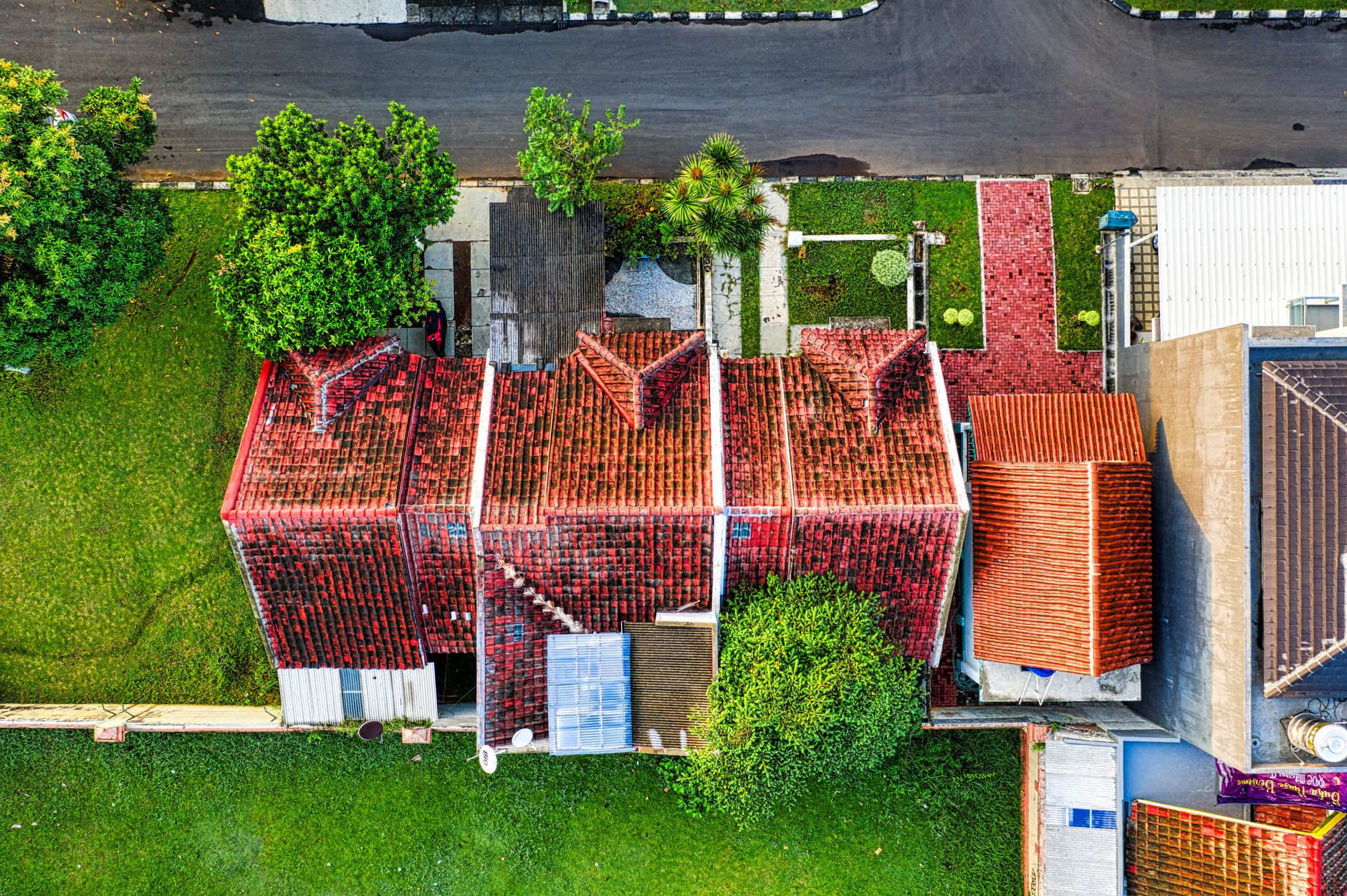 Drone shot capturing rooftops and greenery in Tangerang, Indonesia.